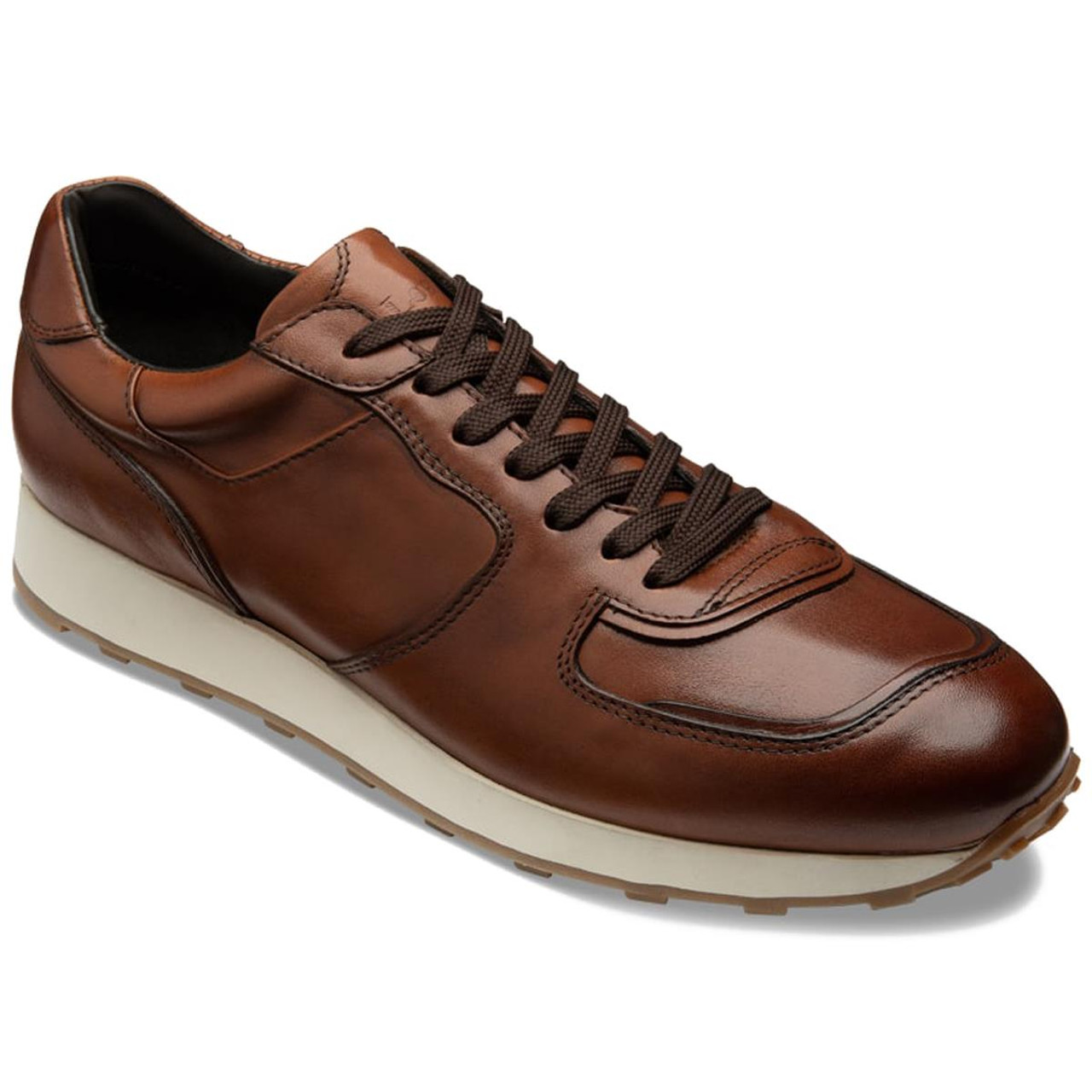 What does the F fitting offer in Loake trainers?